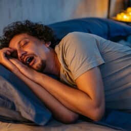 Mid-Adult Man Snoring In The Bed At Night
